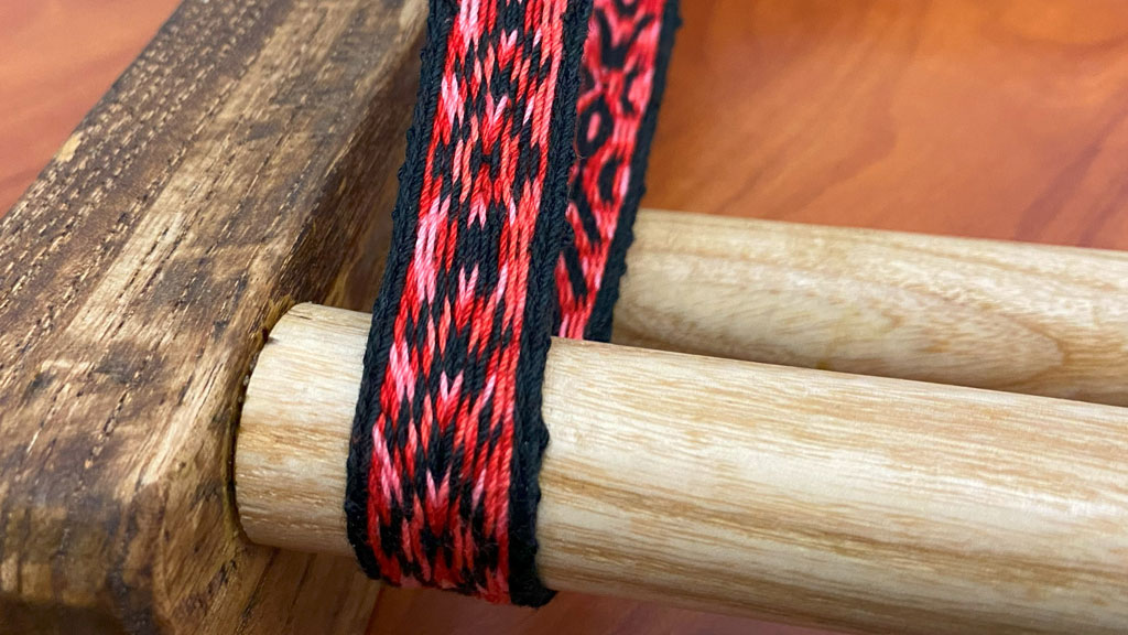 A handmade band weaved on an Inkle loom by Laura Rhodes