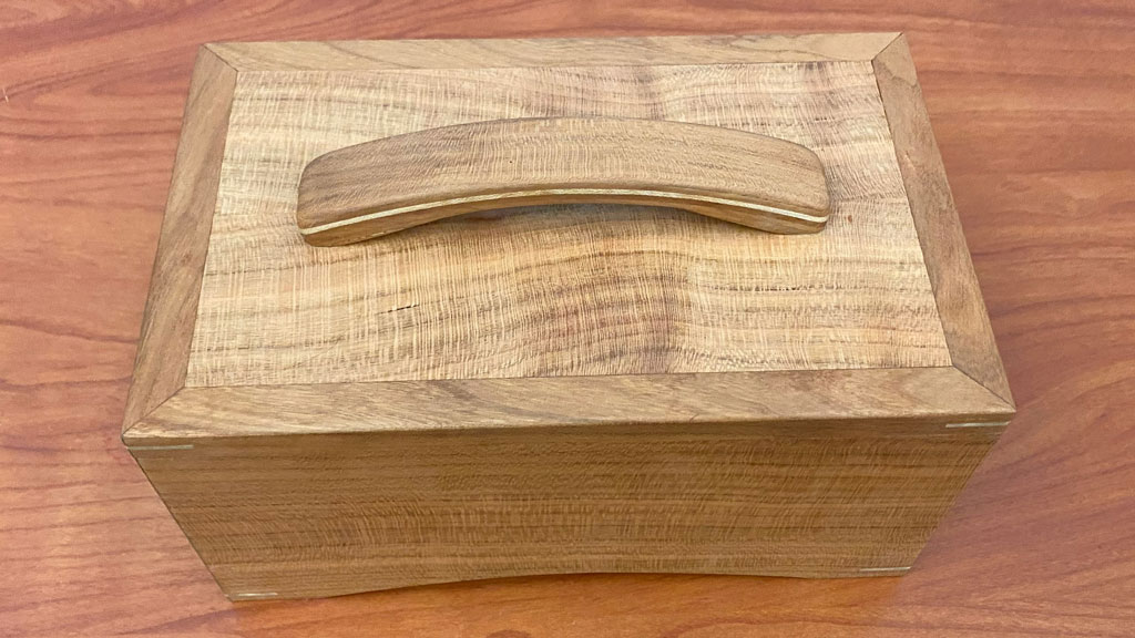 The cherry box with a laminated handle was handmade by Max Goldstein.